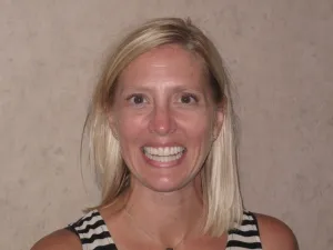 Photo of a patient smiling after getting Orthodontics, Teeth Whitening and Dental Implants Treatment at Tonka Smiles Minnetonka