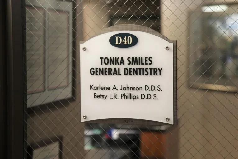 Office sign at the entrance door at Tonka Smiles [CITY] [STATE]