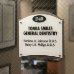 Office sign at the entrance door at Tonka Smiles [CITY] [STATE]