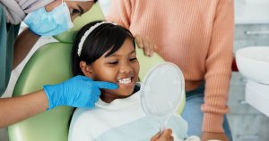 child smiling in dental chair